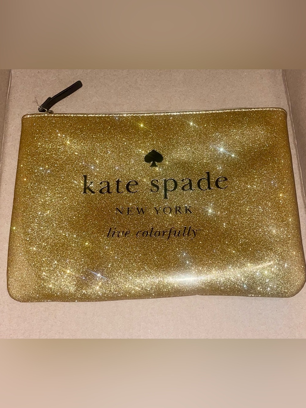 kate spade gold glitter zip pouch with black logo